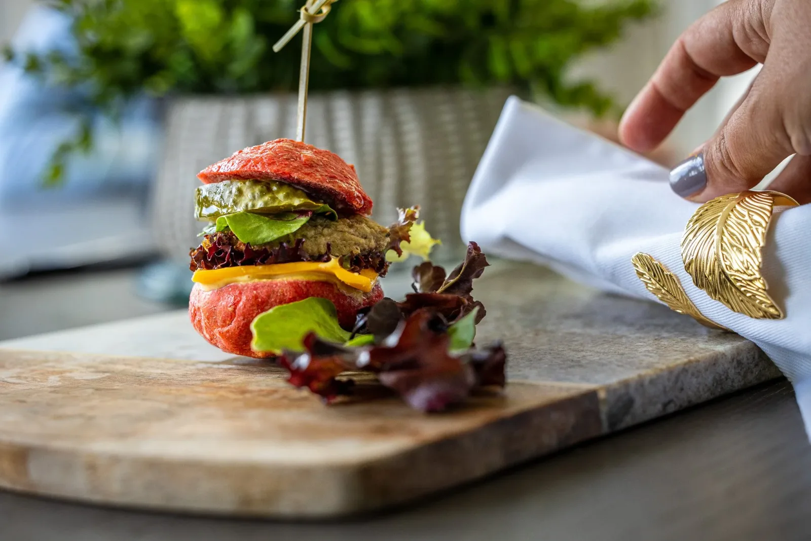 Burger plated on a marble board for a restaurant menu