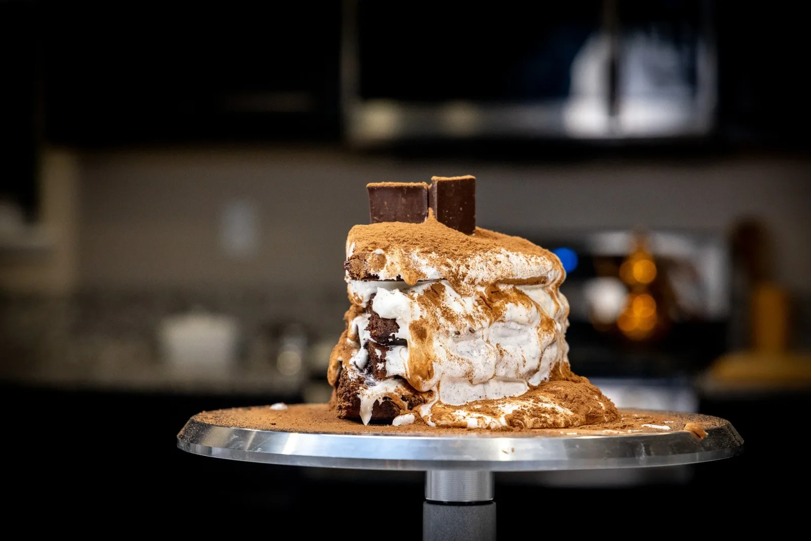 Layered dessert photographed against a dark background
