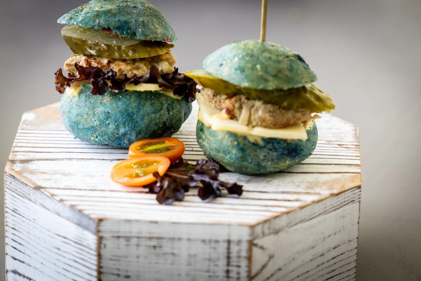 Sliders on a wooden riser, photographed for a cafe